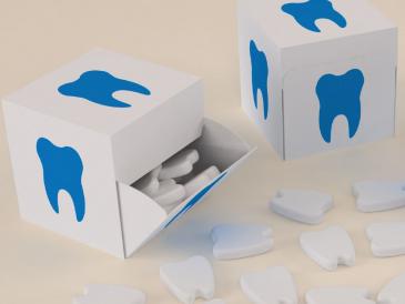 Custom moulded mints in dent tooth shaped logo